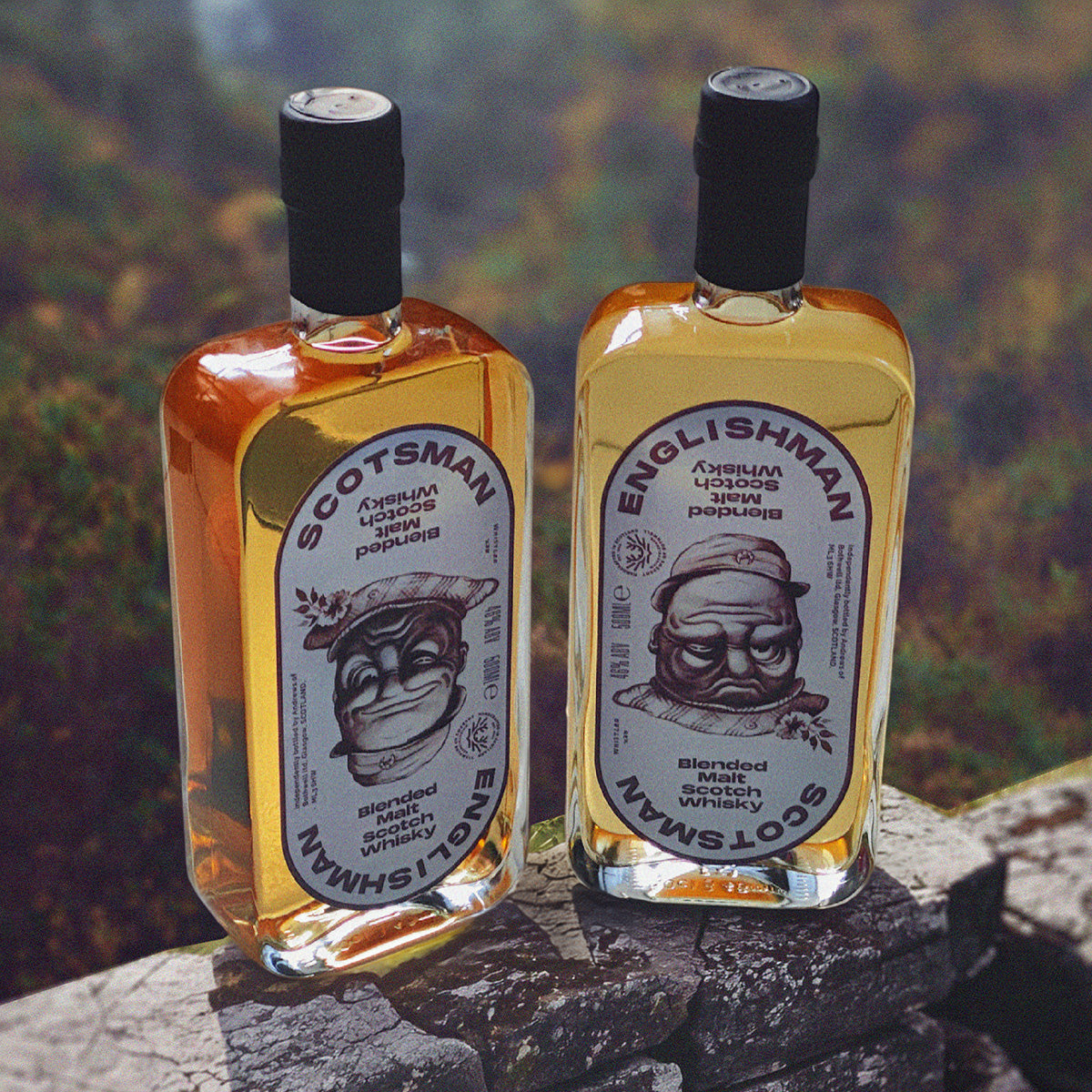 Scotsman and Englishman whisky bottles on a rock in the Scottish countryside